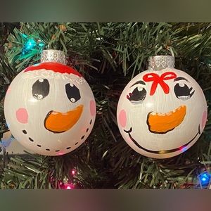 Handpainted set of two glass snow people ornaments. Snowman and snowwoman sets.